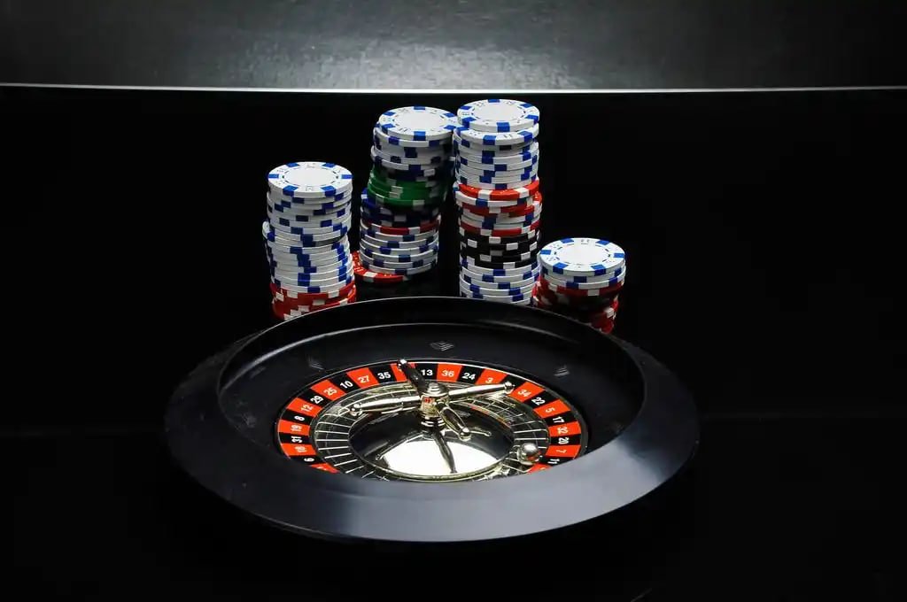 Live dealer studio setup showing blackjack table and professional dealers